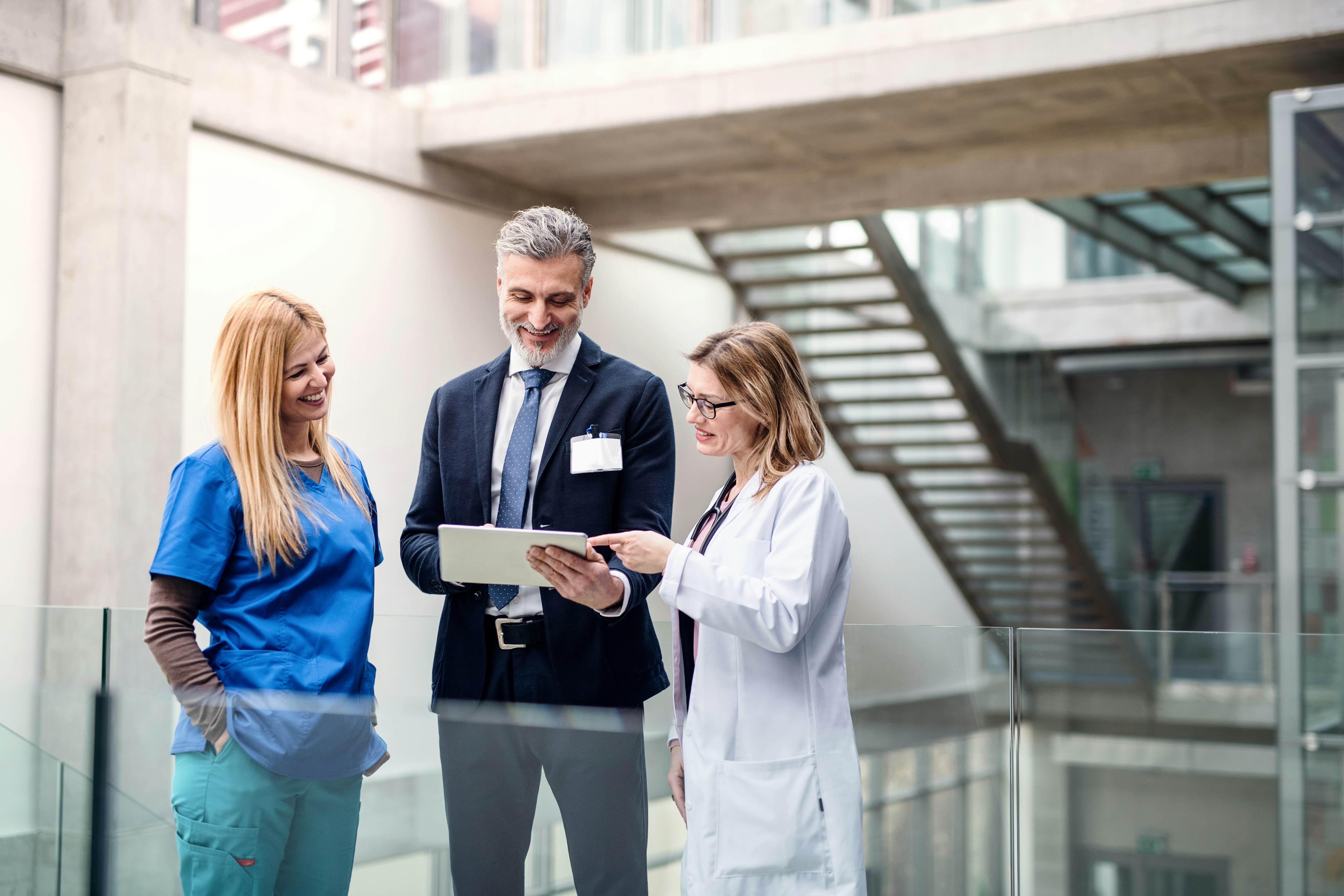 Physician reviewing health data with patient on tablet